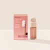 Mesmerize| Rare Beauty's Positive Light Liquid Luminizer Mini in the rose bronze shade Mesmerize.