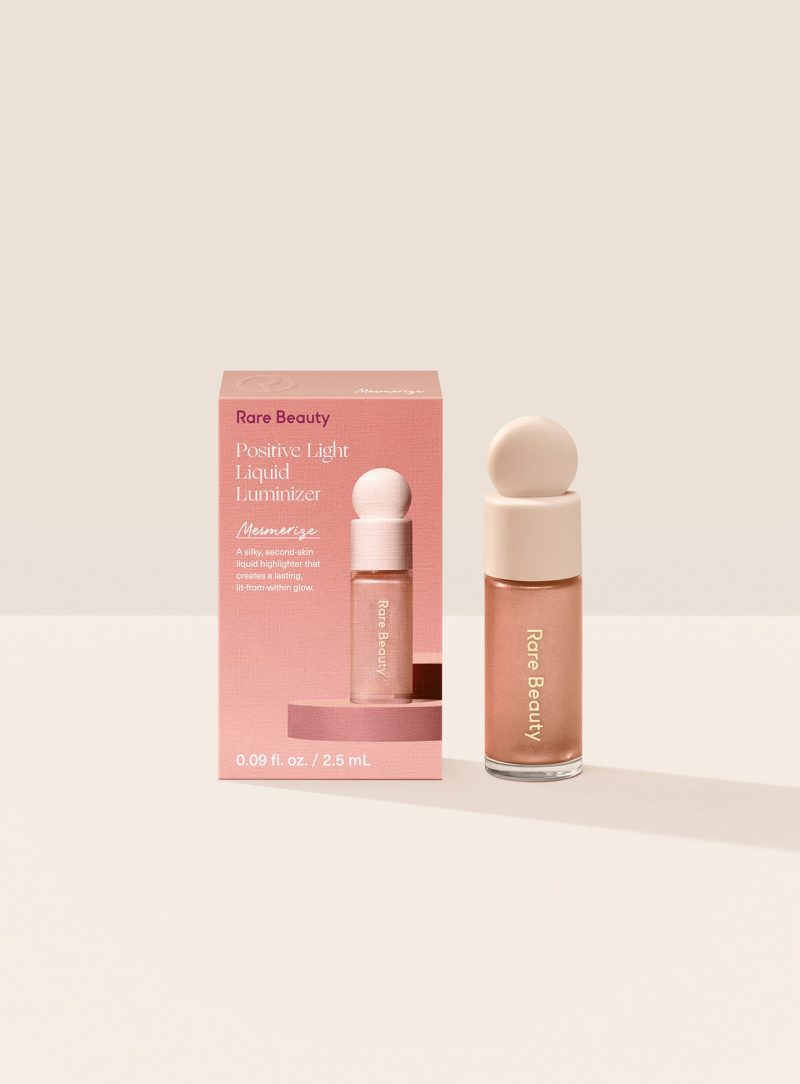 Mesmerize| Rare Beauty's Positive Light Liquid Luminizer Mini in the rose bronze shade Mesmerize.