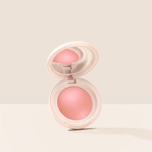 Cheer| Rare Beauty's Soft Pinch Luminous Powder Blush in the shade Cheer opened against a neutral background.