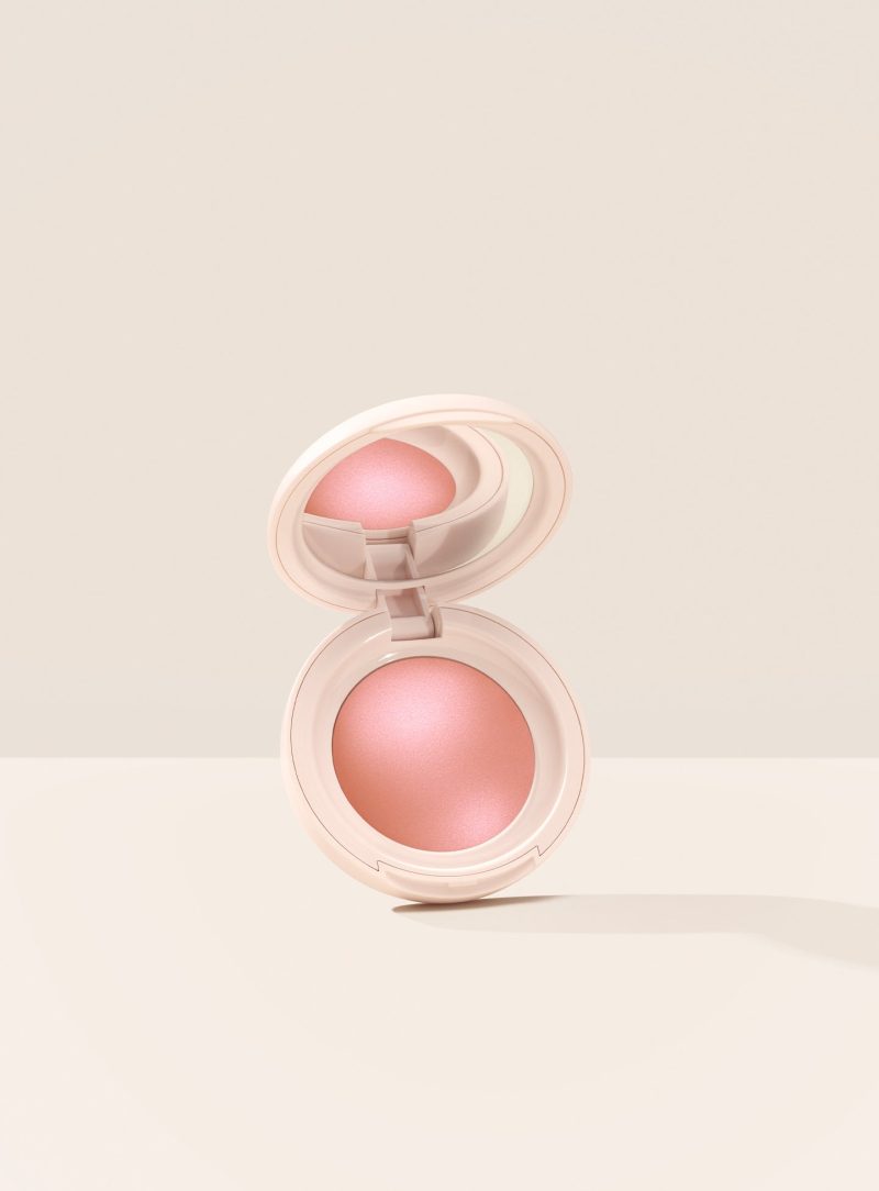 Hope| Rare Beauty's Soft Pinch Luminous Powder Blush in the shade Hope hovering, opened, against a neutral background.