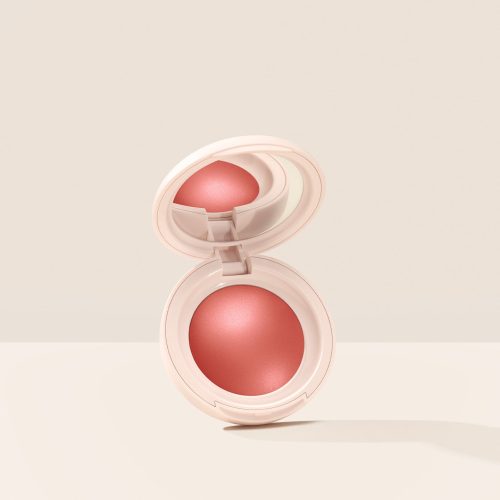 Love| Rare Beauty's Soft Pinch Luminous Powder Blush in the shade Love hovering, opened, against a neutral background.