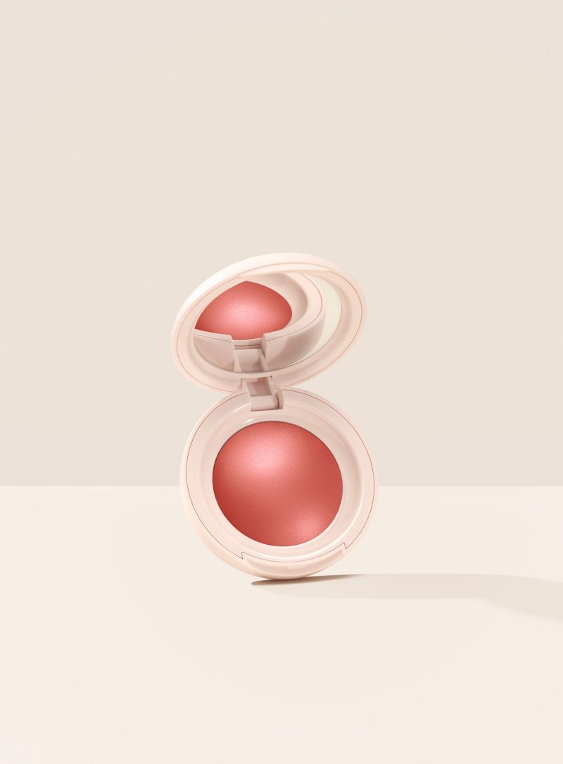 Love| Rare Beauty's Soft Pinch Luminous Powder Blush in the shade Love hovering, opened, against a neutral background.