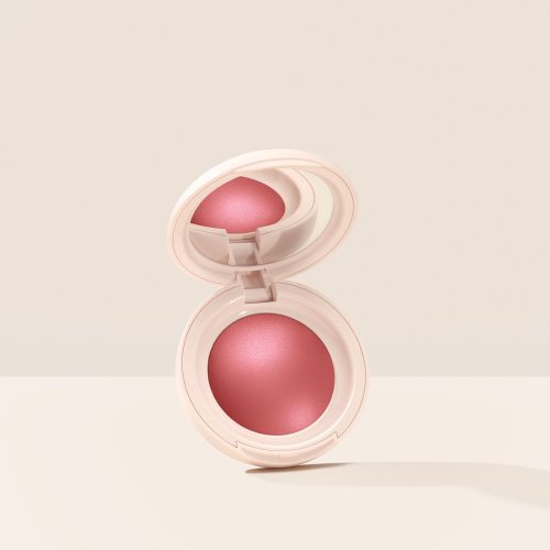 Truth| Rare Beauty's Soft Pinch Luminous Powder Blush in the shade Truth hovering, opened, against a neutral background.