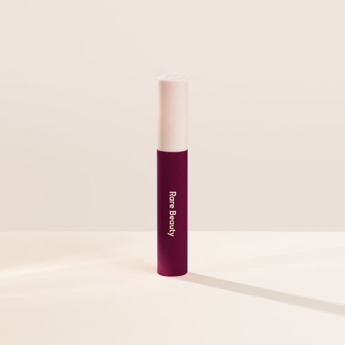 Strengthen| Shade Strengthen, in a dark blue red, of the Lip Souffle Matte Lip Cream by Rare Beauty.