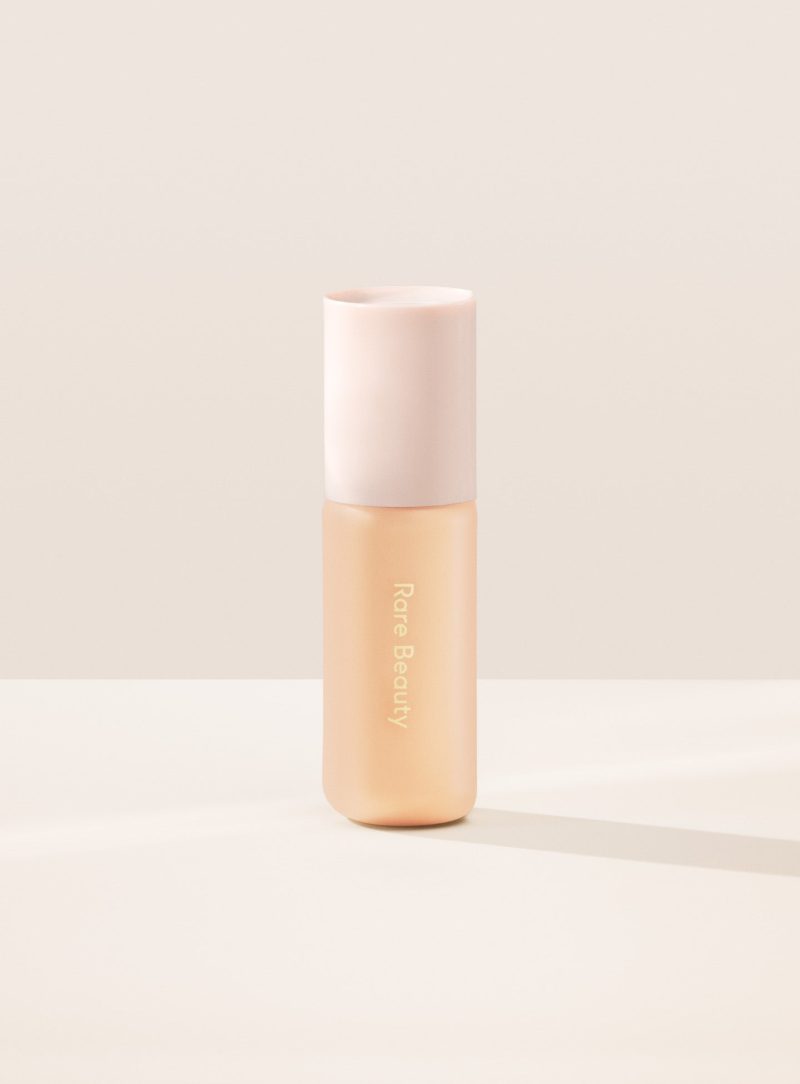 14W| Shade 14W, Light with Warm Golden Undertone, of Rare Beauty's Positive Light Tinted Moisturizer with SPF.