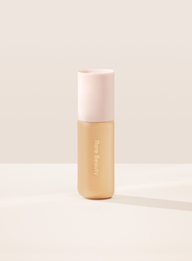 22W| Shade 22W, Light Medium with Warm Golden Undertone, of Rare Beauty's Positive Light Tinted Moisturizer.