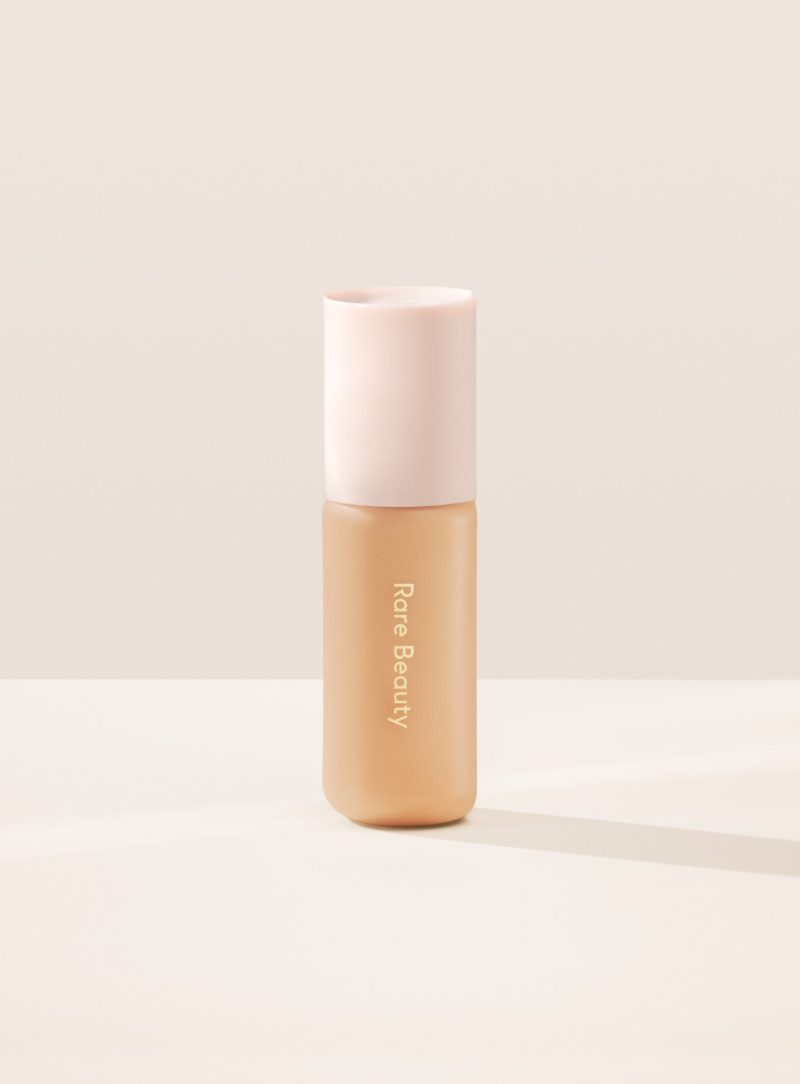 24N| Shade 24N, Light Medium with Neutral Peach Undertone, of Rare Beauty's Positive Light Tinted Moisturizer.